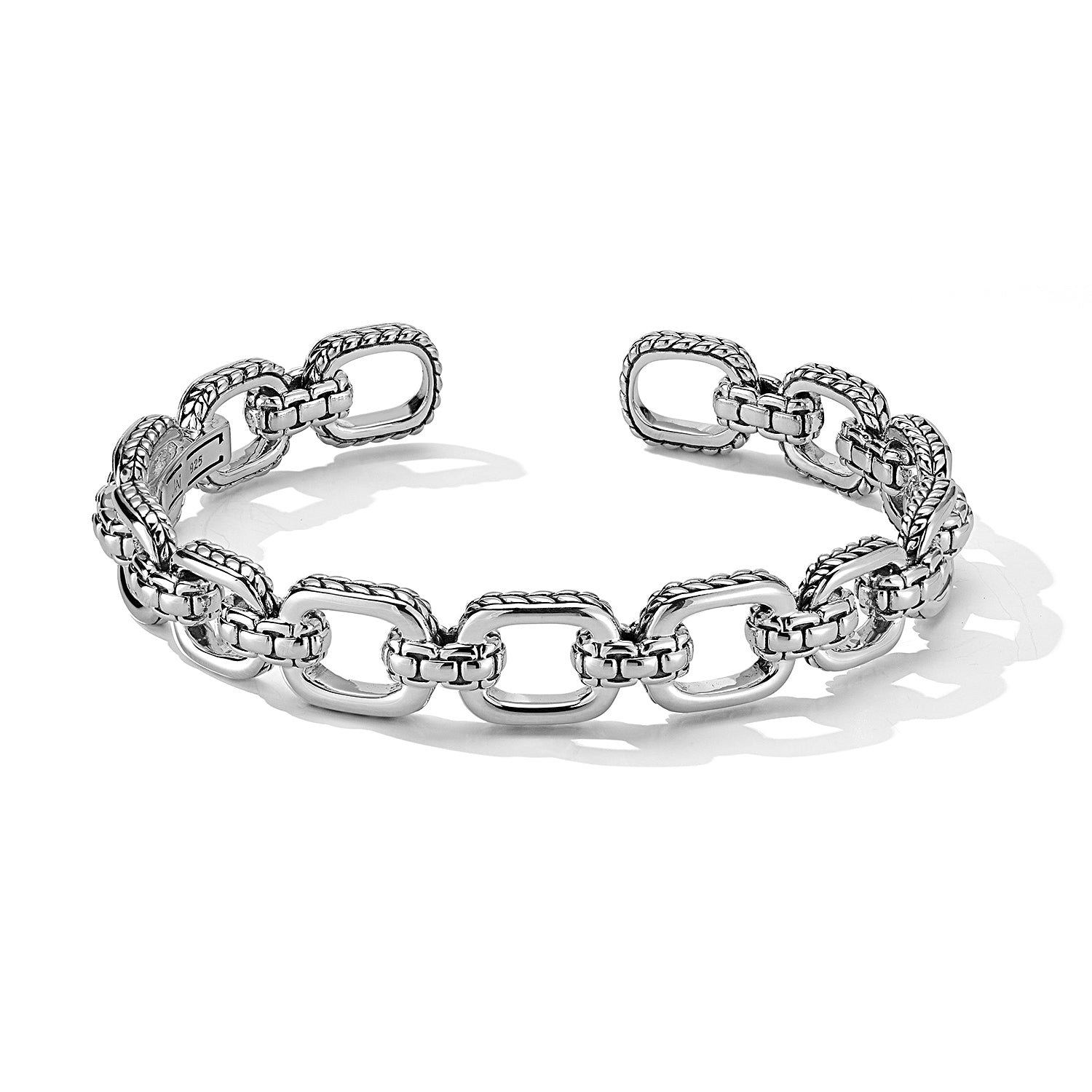Sterling Silver Statement Link Hinged Cuff Bangle features polished rectangular links, trimmed with Basketweave pattern, and alternating Box Chain stations. Cuff opening is 15mm.Available in Sizes (w/