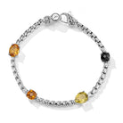 Our Sterling Silver Origin Box Chain Gemstone Bracelet in Forest features five segments of 3.7mm Box Chain and multi sized and cut Black Spinel, Citrine, Cognac Quartz and Olive Quartz gemstones, set 