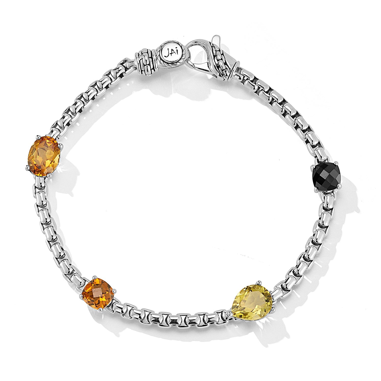 Our Sterling Silver Origin Box Chain Gemstone Bracelet in Forest features five segments of 3.7mm Box Chain and multi sized and cut Black Spinel, Citrine, Cognac Quartz and Olive Quartz gemstones, set 