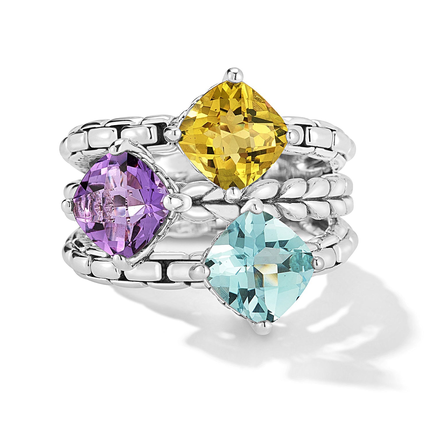 Our Sterling Silver Multi Gemstone Ring in Sea features 7x7mm cushion Sky Blue Topaz, Amethyst and Olive Quartz gemstones set in Box Chain pattern stage. The gemstones are perched atop our modern arti