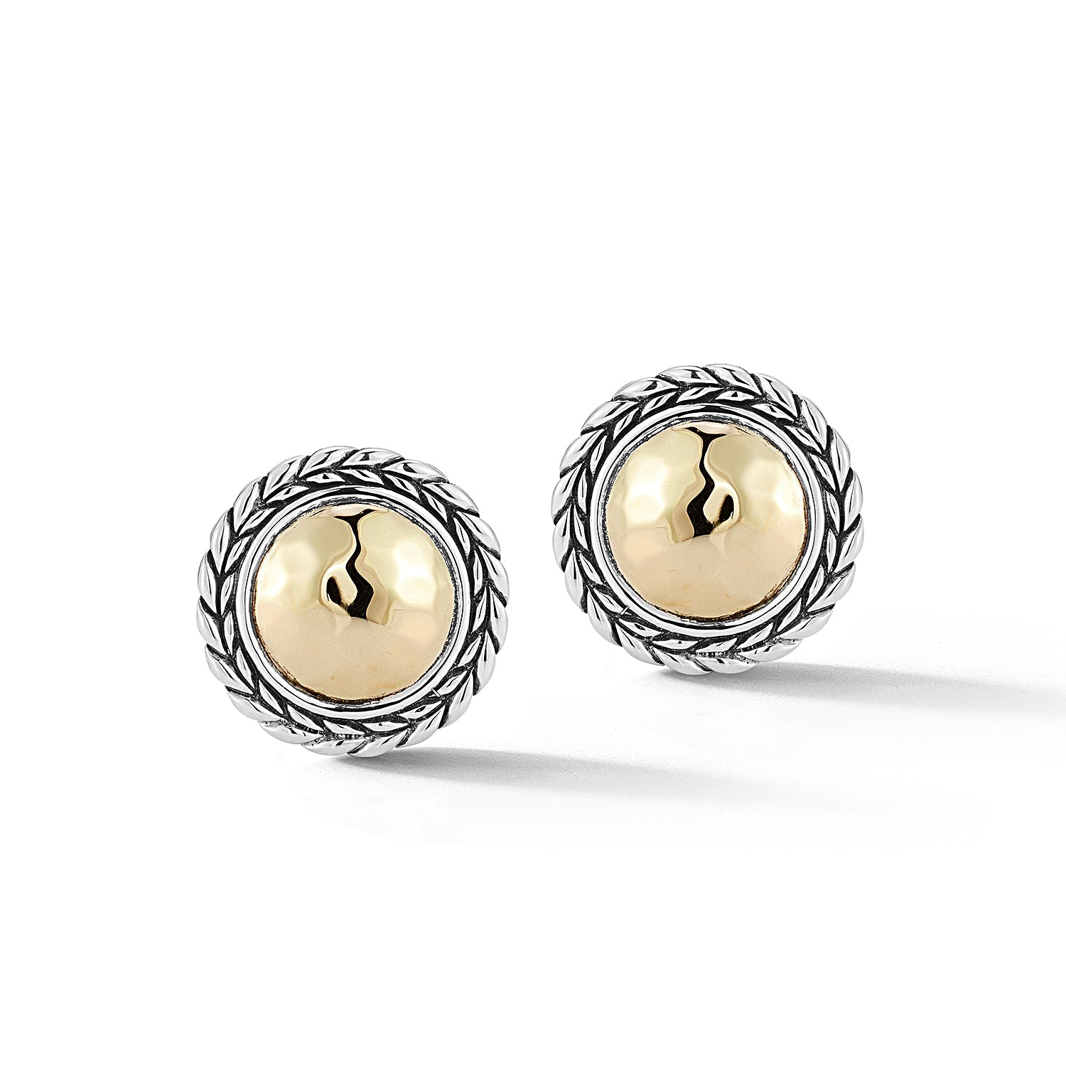Our Sterling Silver & 14K Gold Round Stud Earrings showcase a 14K Gold Hammered design element adorned with Basketweave pattern. Post and Omega findings.