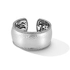 Our Sterling Silver Wide Hammered Hinged Cuff Bangle is trimmed with Basketweave and features our signature carved art work on inner surface. Cuff opening is 15mm.Sizes with Inside Dimensions:Large (5