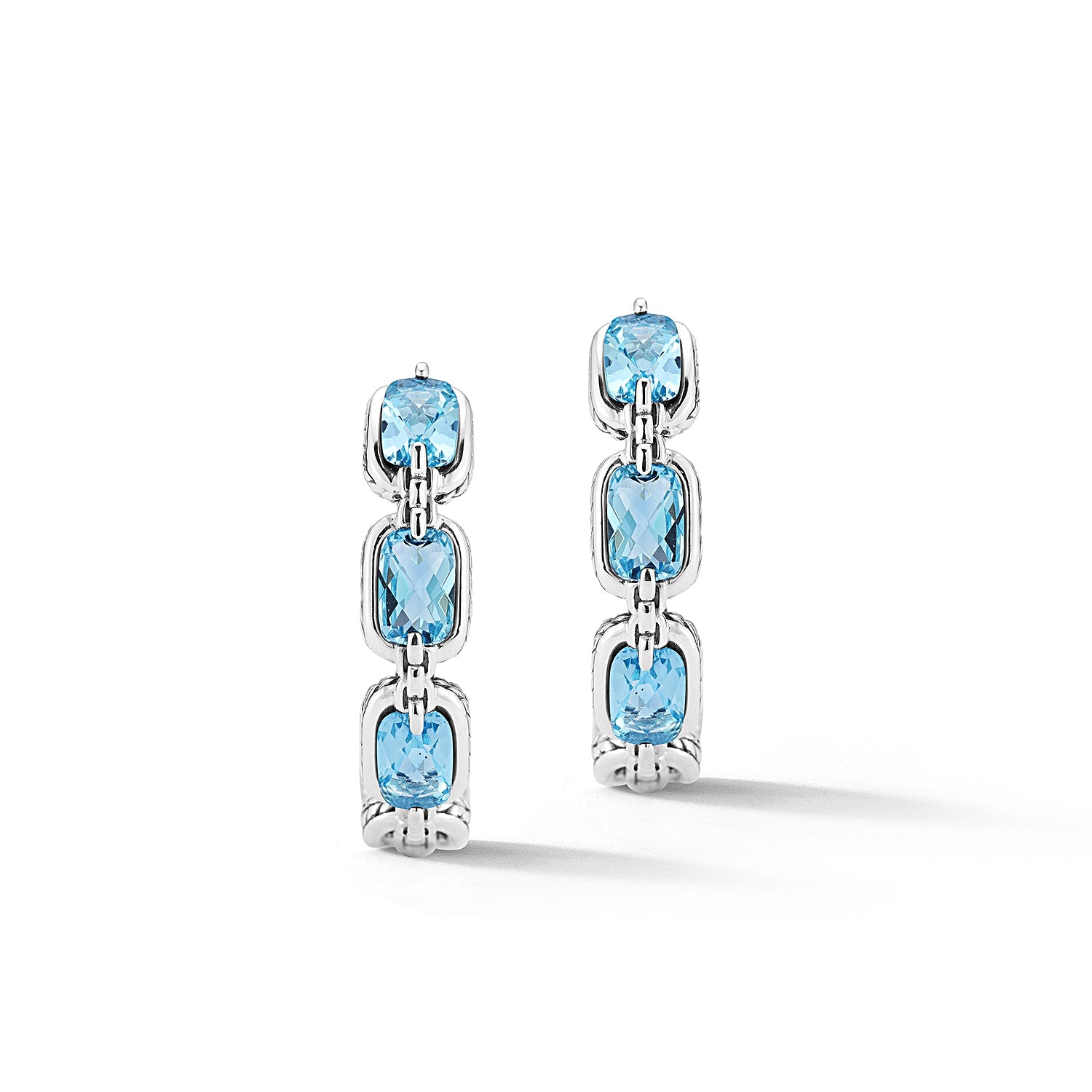 Our Sterling Silver Statement Link & Gemstone Hoop Earrings showcase 6x4mm cushion Light Swiss Blue Topaz, set horizontally and outlined with chain-woven design element, and Box Chain pattern bridge e