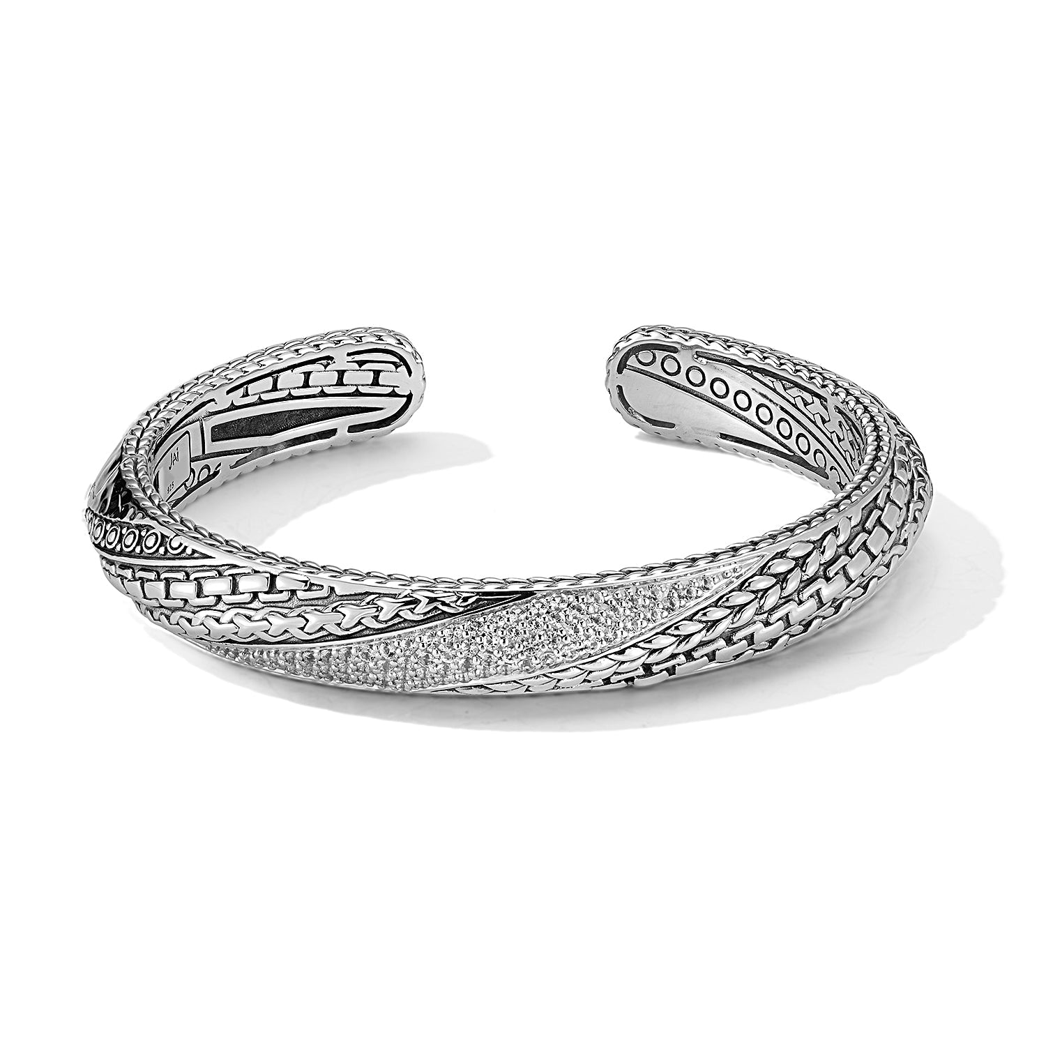 Our Sterling Silver Master Artisan & Gemstone Hinged Cuff Bangle, measuring 10mm in surface width, features our classic textured design elements and an arrangement of 1.5mm round faceted White Spinel 