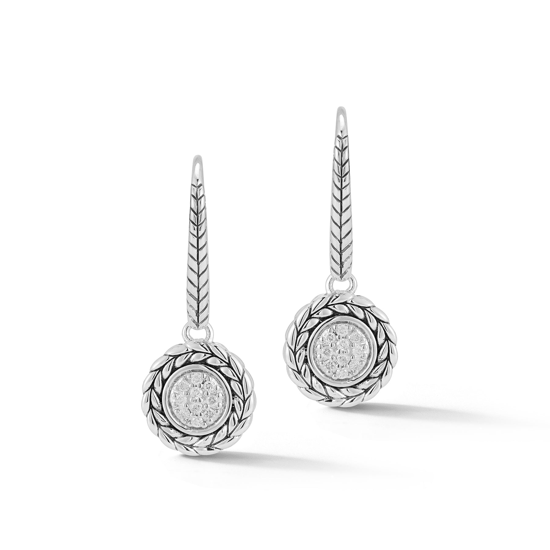 Our Sterling Silver & Diamond Disk Drop Earrings showcase round center element of brilliant Diamonds, adorned with Basketweave pattern, and dangle from Basketweave pattern Lever Backs.Stone Informatio