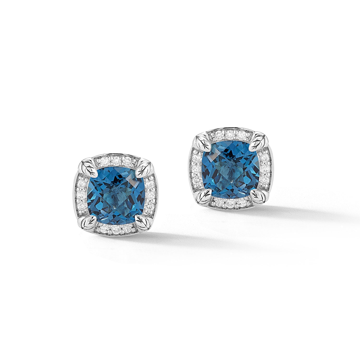Our Sterling Silver Signature Diamond & Gemstone Square Stud Earrings showcase 6x6mm cushion London Blue Topaz highlighted with a perimeter of brilliant Diamonds.Stone Information:Treated London Blue 